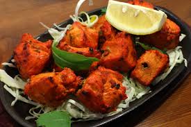 Boneless chicken breast marinated  in garlic, ginger and chef's special spice mix and grilled in the tandoor